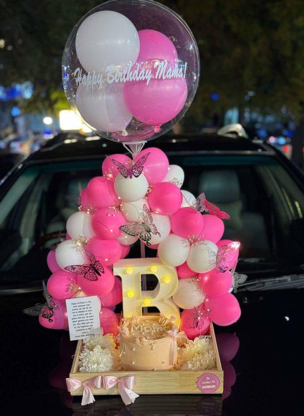 Luxury wooden tray with balloon arch, custom cake, LED letter, and flowers – The LuvBox PK gift shop in Islamabad