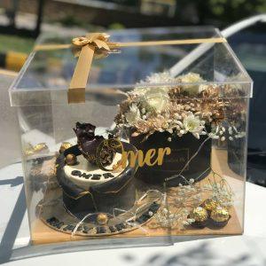 Luxury acrylic gift box with custom cake, Ferrero Rocher chocolates, flowers, and personalized message from The LuvBox PK