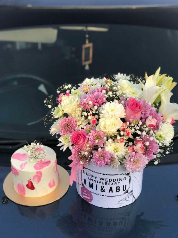 Custom floral gift box with cake – roses, chrysanthemums, butterflies, and a 2 Lbs cake for birthday in Islamabad