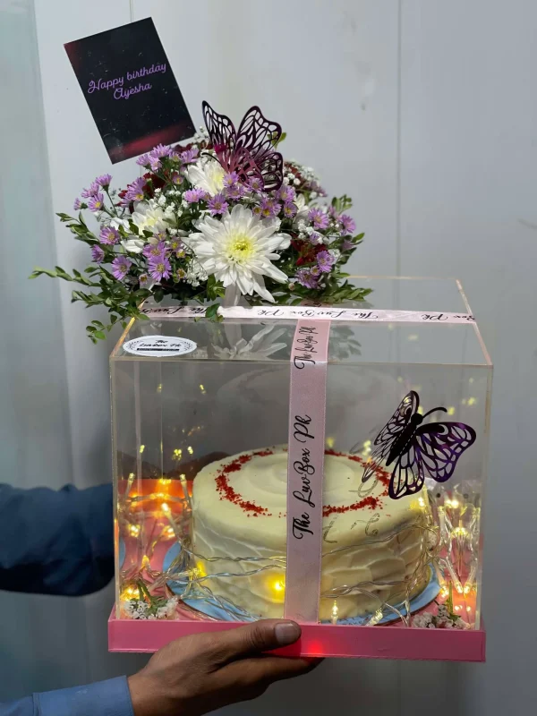 Luxury acrylic cake box with flower arrangement on top by The LuvBox PK – gift shop in Islamabad