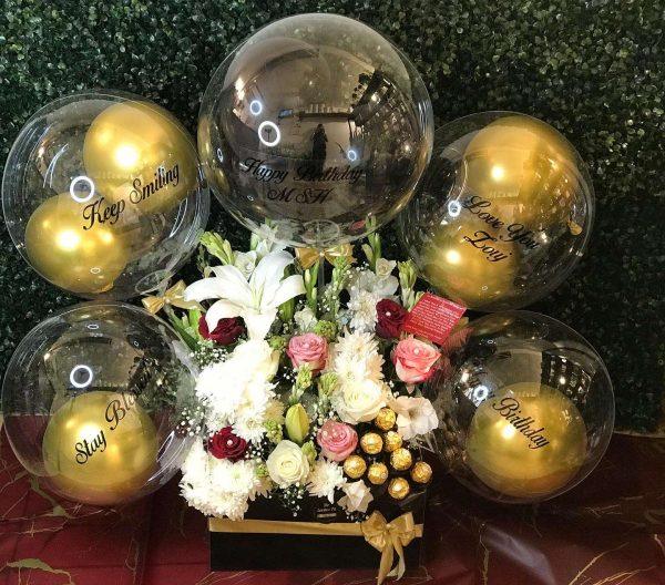 Birthday gift box with multiple transparent customized balloons, chocolates and flowers – The LuvBox PK, gift shop in Islamabad