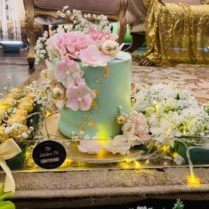 Bloom and Cake Majestic floral cake with Ferrero in acrylic tray by Gift Shop Islamabad