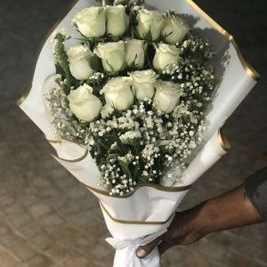 Elegant white rose bouquet wrapped beautifully for him – Gift Shop Islamabad Islamabad.