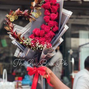 Heart-shaped bouquet with red roses and petals – romantic gift by Gift Shop Islamabad, gift shop in Islamabad.